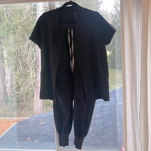 Figs black moto scrubs size medium in top and medium in bottoms.